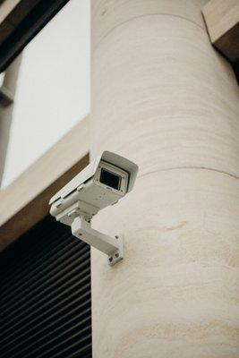 Performin security camera installed on a commercial property