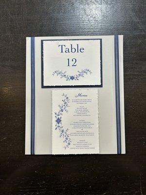 handcrafted navy floral table number and menu