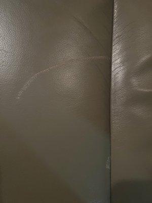 Damage to drivers seat leather from vacuum.