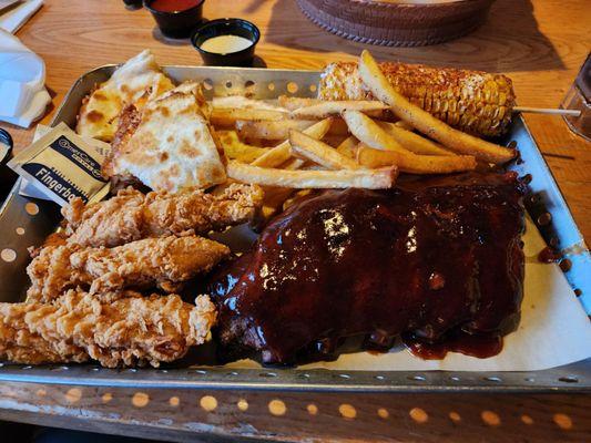 Chicken tenders, half rack ribs, fries, chicken bacon ranch quesadilla and street corn.