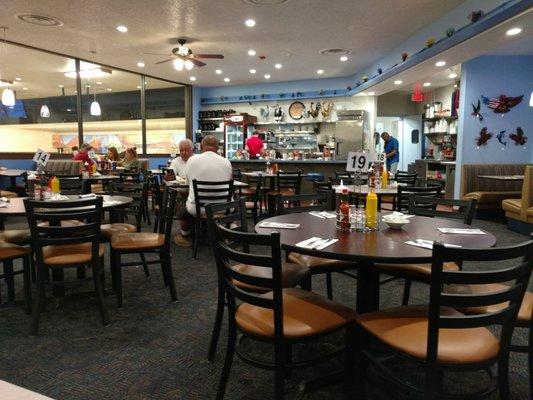 The service counter, the decor and plenty of seating.