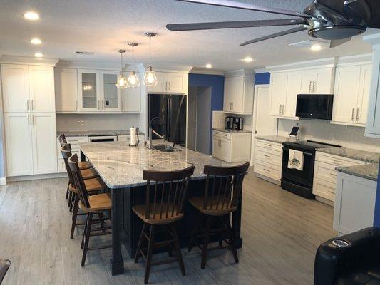 White and dark contrast cabinets with granite tops