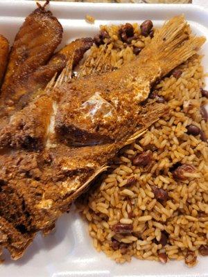 Red snapper, peas and rice and plantain close-up.