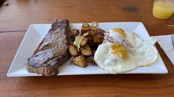 Steak, eggs and potatoes.