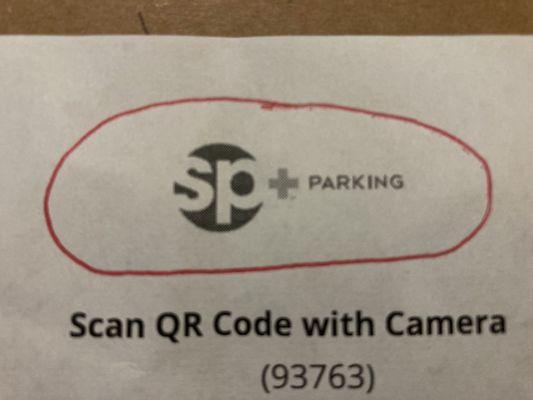 close-up view of parking aid distributed by SP+ Parking (note name of company encircled in red ink)