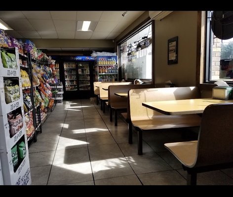 Inside seating, back coolers with all your drinks, coffee on right on top of counter.