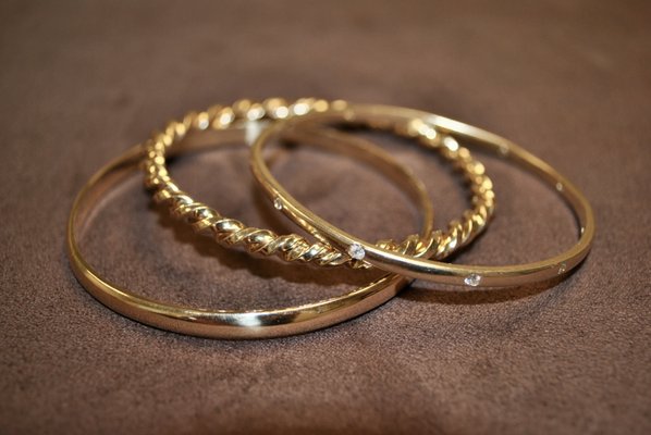 Custom bangle bracelets made from a customer's old gold jewelry