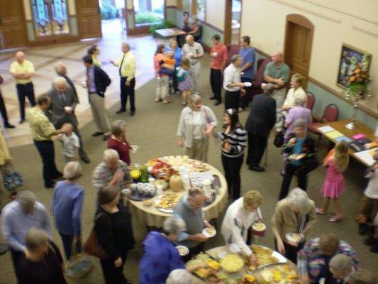 People in gathering area following worship