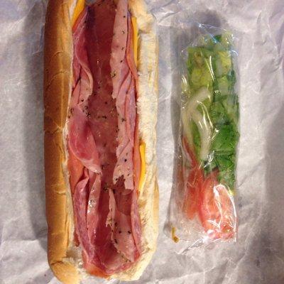 Italian sub with cheddar cheese. The lettuce, tomato and onion is packaged separately.