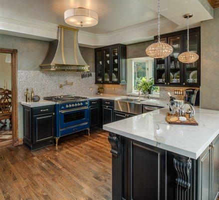 What a fabulous kitchen!  Fieldstone cabinets and a blue range from France.