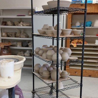 Look at all those bowls to be fired!