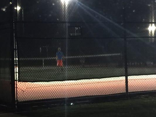 My son playing tennis w another boy... You can't really see him..