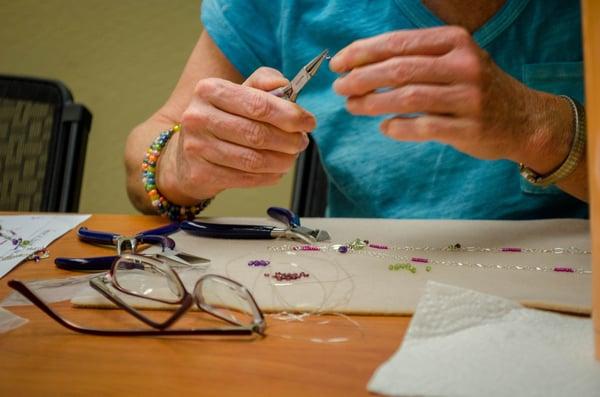 Creating wonderful jewelry in our evening beading class.