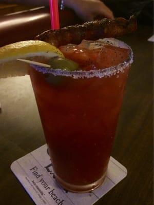 Spicy clamato Bloody Mary with bacon lollipop.