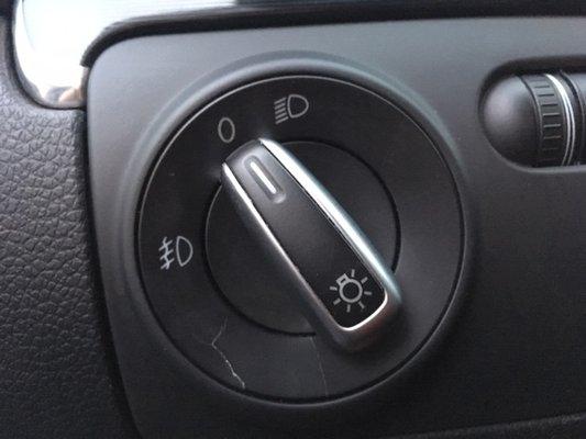 The bottom plastic is scratched and cracked, presumably because the mechanic didn't know not to turn the knob to 'fog'.