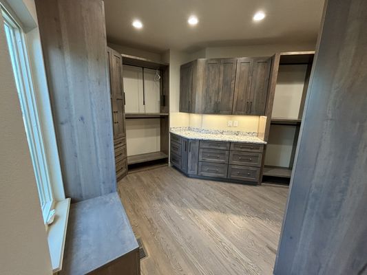 Barn-style walk-in closet: rustic charm meets ample storage, offering a stylish and organized space.