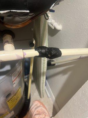 "Taped" drain line leaking water.