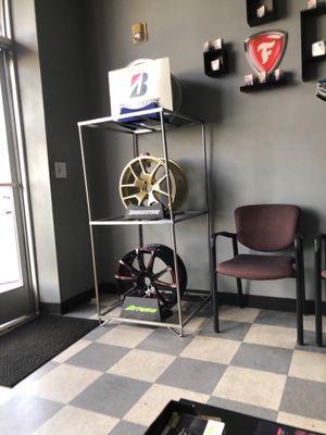 Rims in the waiting room making me want to get some new shoes for my car