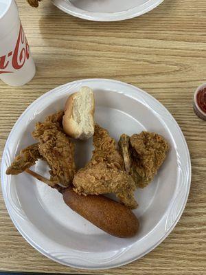 Corn dog and chicken wings with a roll