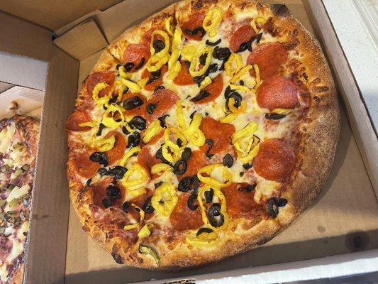 Pepperoni, banana peppers, and black olives.  Delicious!