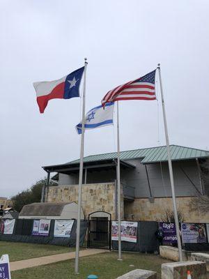 The flags outside of the gym and education centers.