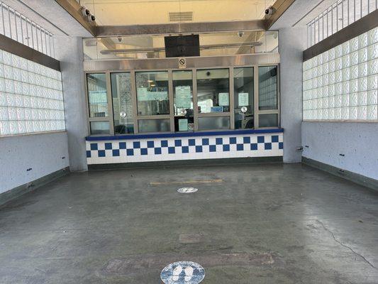 Ticket, passes cashier and information booth window inside Manchester Transit Center