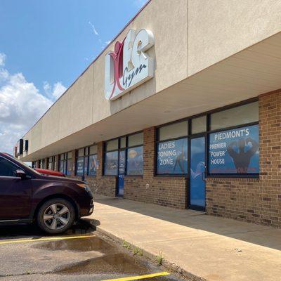 Gym storefront with sign.