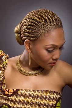 Sarah International Hair Braiding & Weave:  A cornrow style sure to have you stand out with elegance on your next night out.