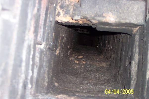 This is an unlined chimney servicing an oil furnace.  These older chimneys are not air or moisture tight.