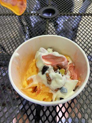 Orange, whipped cream, red velvet, chocolate rocks, vanilla, & strawberry fro-yo