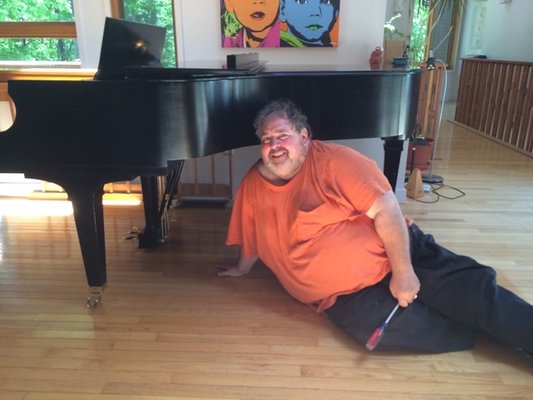 Jimmy Burgoff setting up a piano