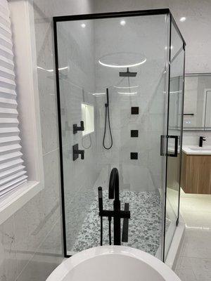 3 glass panels in matted black shower door