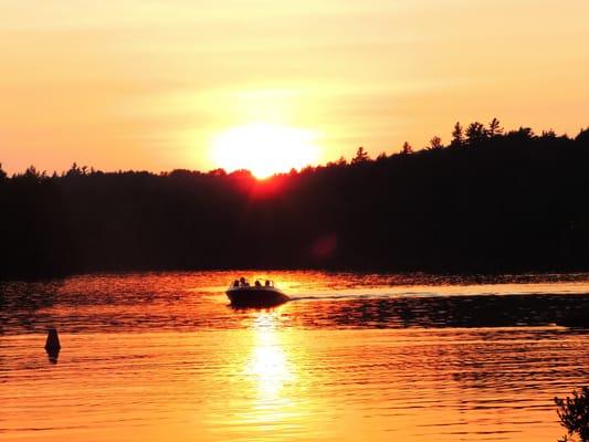 Boating on Kiwassa Lake amidst a gorgeous sunset view