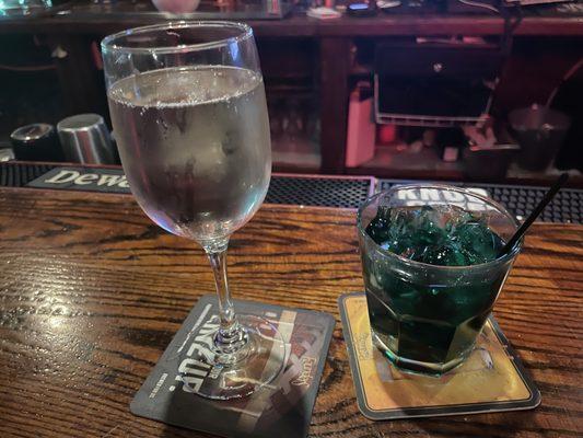 Glass of Sauvignon Blanc and glass of Creme de Menthe