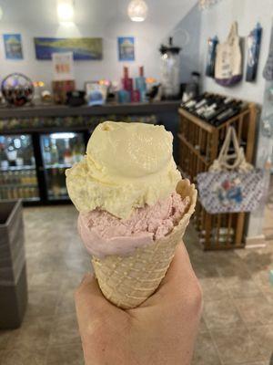 Large waffle cone with vegan pineapple passion fruit and traditional dairy strawberry gelato