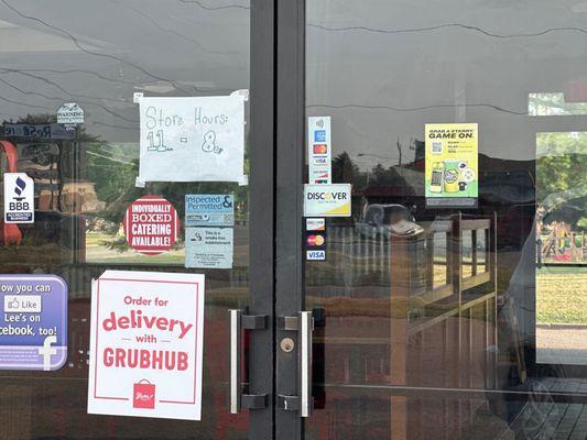 Hand written sign that states their hours they don't uphold!