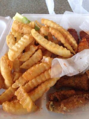 Lemon pepper and Medium spicy wings with French fries