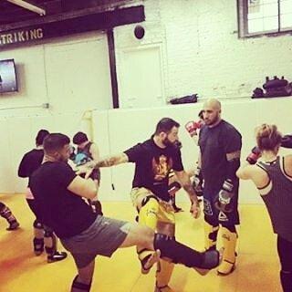 Head Coach Aaron Meisner working technique with students.