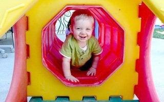 Look at me! I can crawl through this tunnel!