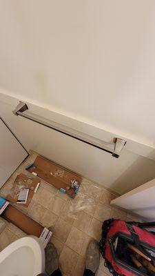 New towel bar installed in half bath