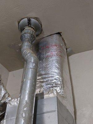 New furnace attached to 30-year-old roof vent pipe.