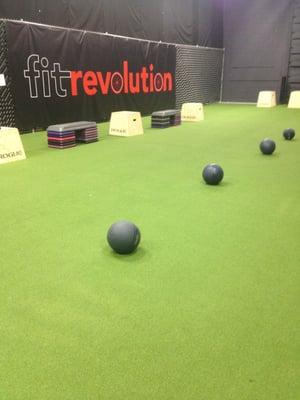 Small Turf at Fit Revolution that provides a variety of equipment - TRX, Treadmills, Indoor Rowers, free weights, and more!