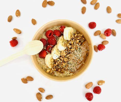 Gluten-free oats, oat milk, hemp seeds, maple syrup, organic berries, creamy almond butter, homemade granola.