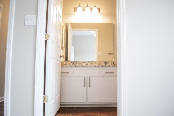 Updated master bathroom with granite countertops.