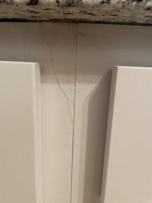 Damaged cheap cabinet on face