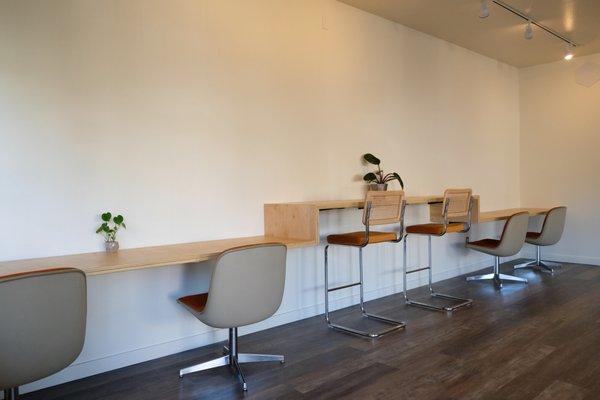 Communal desk space along the South wall at Bacana Cowork!