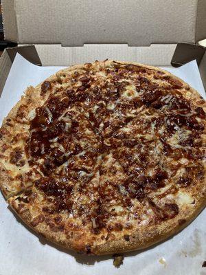 Large bbq chicken pizza with bacon added.