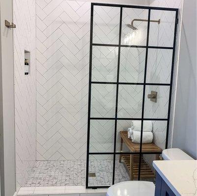 Modern bathroom remodel with beautiful French shower doors.