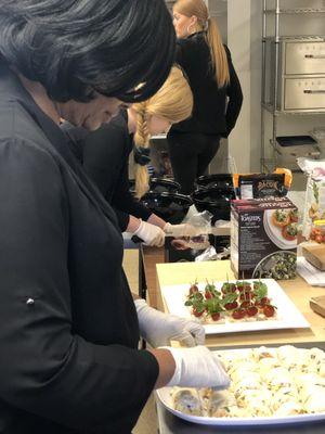 Social Staff on Demand beautifying the hors d'oeuvre platters.