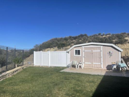 The vinyl was installed next to our shed and provides privacy to shield our booster pump and sprinkler stuff!